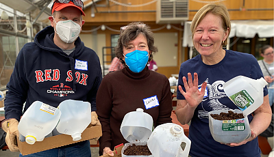 staff and volunteers at the Winter Seed Sow event banner
