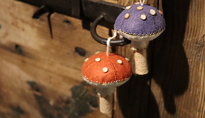 two sewn felt mushrooms banner